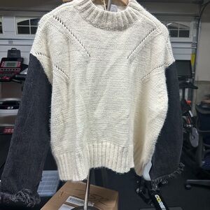 Knit sweater with jean sleeve